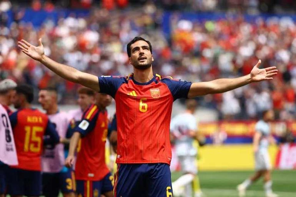 Spain into World Cup semi-final against France after Merino's late winner beats Belgium